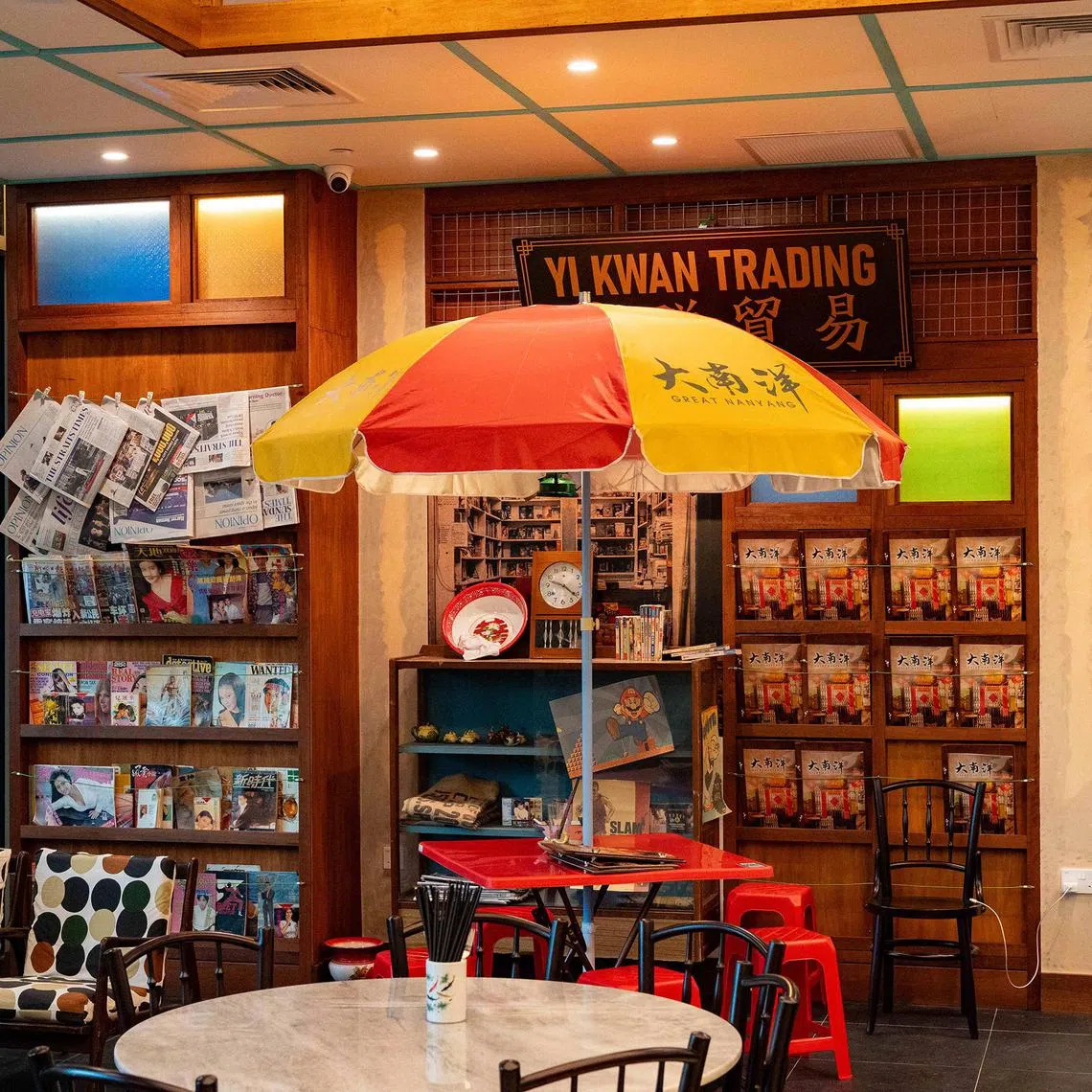 mccafe - Retro-themed Great Nanyang Heritage Cafe is decorated with items from the past, from old telephones to sewing machines. It is founded by Mr Keith Kang (pictured). 
Credit: Great Nanyang Heritage Cafe