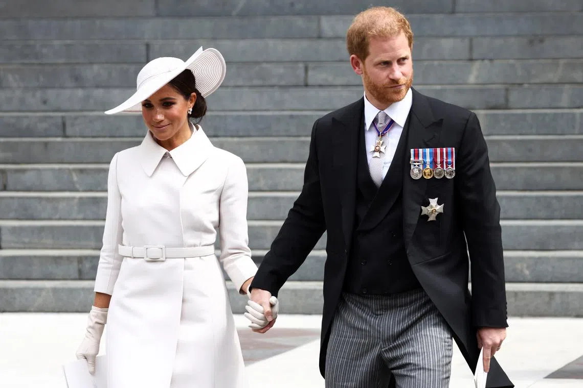 FILE PHOTO: Britain's Prince Harry and Meghan, Duchess of Sussex, hold hands as they depart after the National Service of Thanksgiving held at St Paul's Cathedral during the Queen's Platinum Jubilee celebrations in London, Britain, June 3, 2022. REUTERS/Henry Nicholls/ File photo
