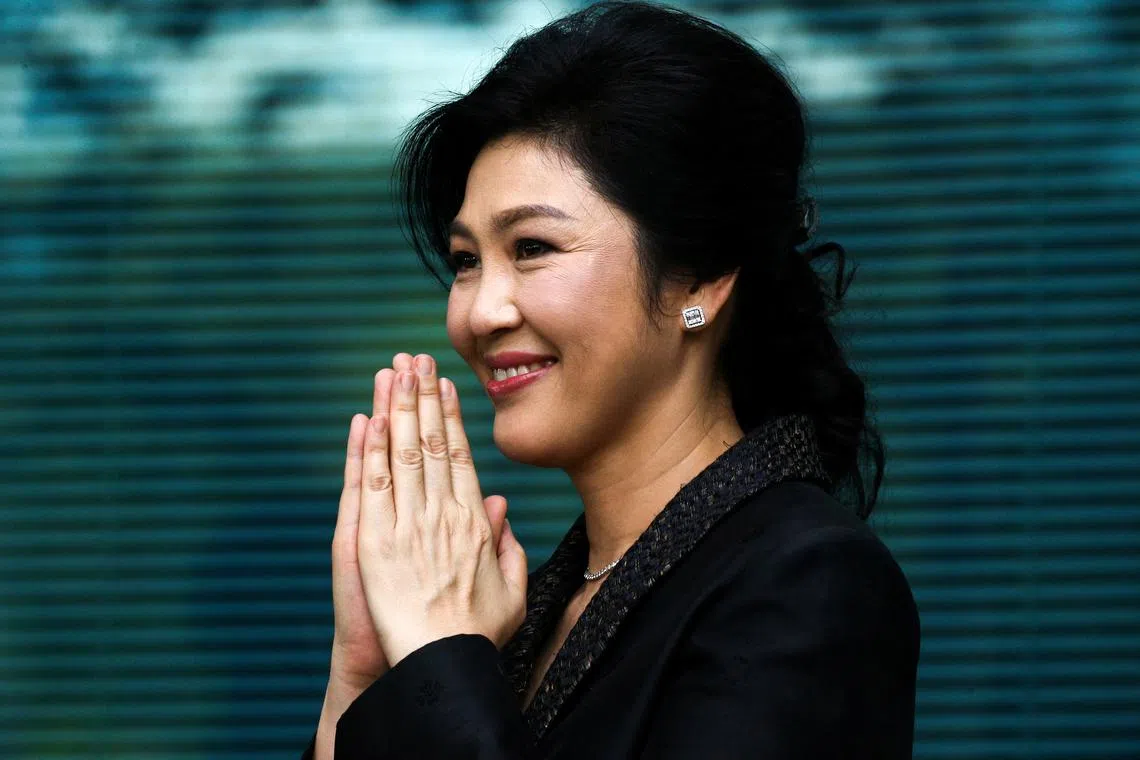 FILE PHOTO: Ousted former Thai prime minister Yingluck Shinawatra greets supporters as she arrives at the Supreme Court in Bangkok, Thailand, August 1, 2017. REUTERS/Athit Perawongmetha/File Photo