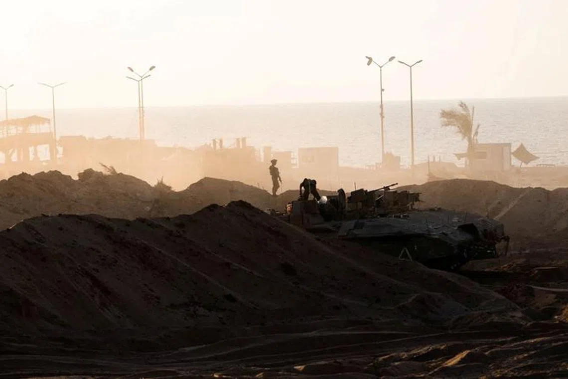 Israeli soldiers operate in the Gaza Strip, amid the ongoing ground operation of the Israeli army against the Palestinian Islamist group Hamas, in this handout picture released on November 18, 2023. Israel Defense Forces/Handout via REUTERS/File Photo