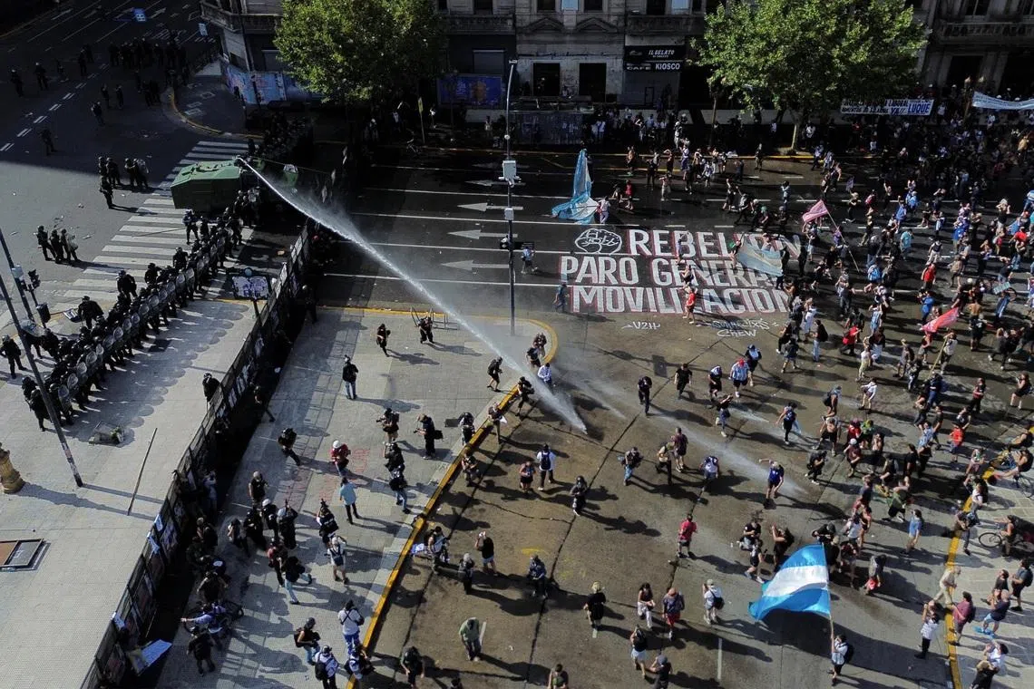 Demonstrators take part in a protest outside Argentina's National Congress on the day lawmakers discuss labor reforms proposed by President Javier Milei's libertarian government to attract investment and revive growth, which unions say would roll back workers' rights, in Buenos Aires, Argentina February 19, 2026. REUTERS/Alessia Maccioni