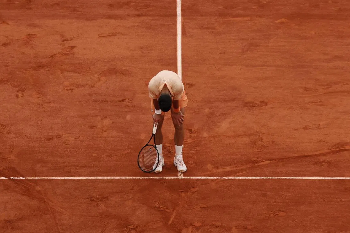 An exhausted Novak Djokovic during his five-set epic against Joao Fonseca at the French Open on May 29.