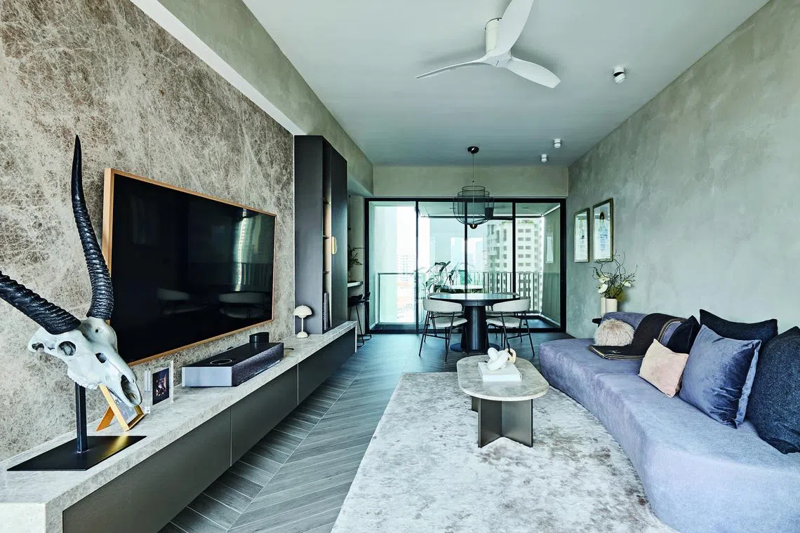 A textured wall in the living and dining area creates visual interest without looking too busy.