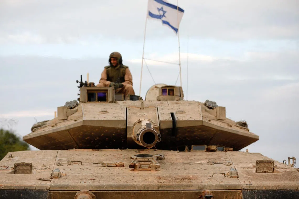 An Israeli tank positioned in the western Galilee area, near Israel's northern border with Lebanon on Oct 30.