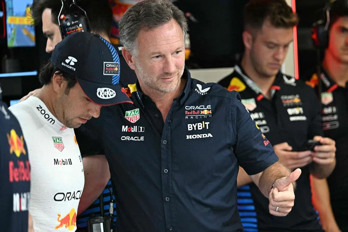 Red Bull team boss Christian Horner (centre) proposed the idea of a non-championship 10-car sprint race for rookies. at a recent meeting of the Formula One Commission.