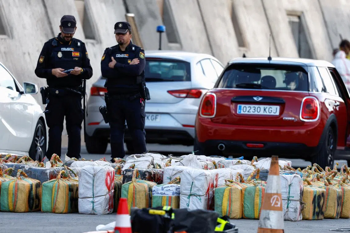 FILE PHOTO: Police officers discharge drugs from the cattle ship Orion V that was seized off the Canary Islands, in the port of Las Palmas, in the island of Gran Canaria, Spain, January 26, 2023. REUTERS/Borja Suarez/File photo