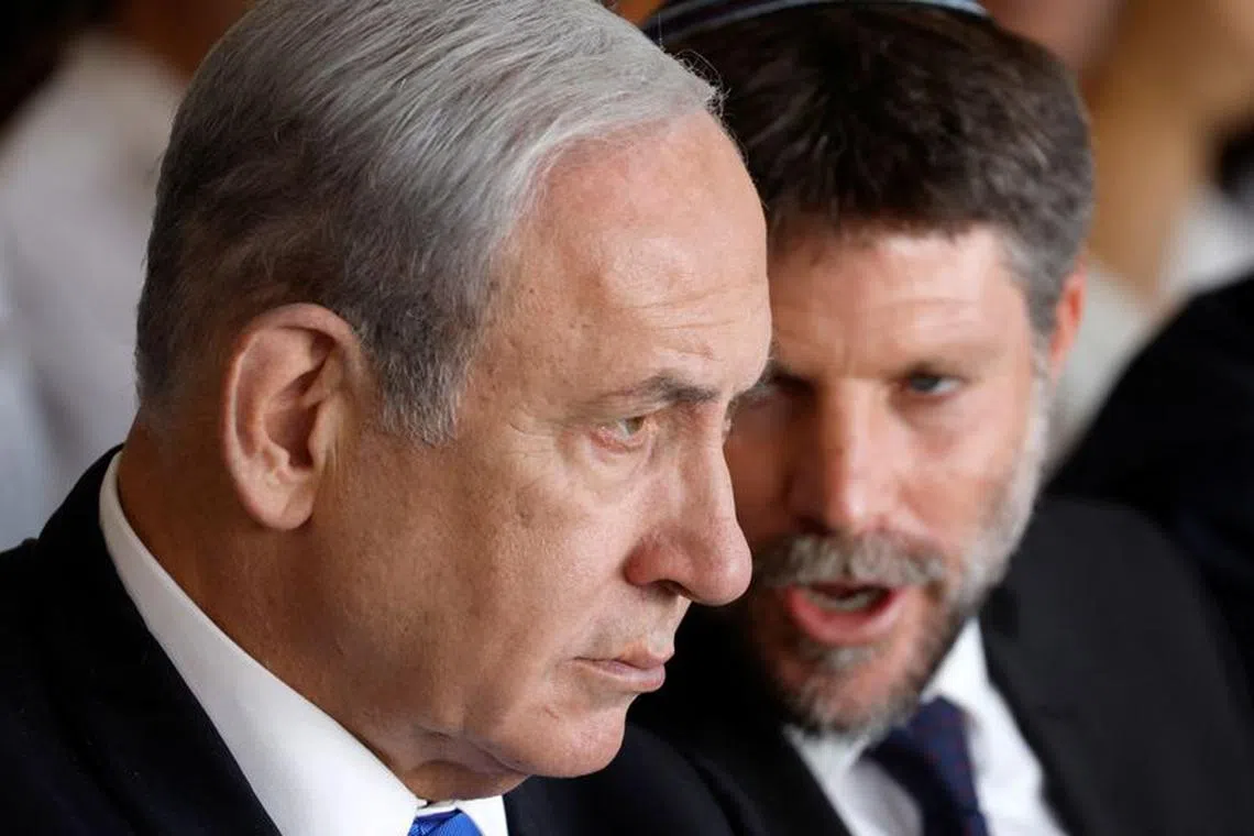 Israeli Prime Minister Benjamin Netanyahu and Israeli Finance Minister Bezalel Smotrich attend an inauguration event for Israel's new light rail line for the Tel Aviv metropolitan area, in Petah Tikva, Israel, August 17, 2023. REUTERS/Amir Cohen/File Photo