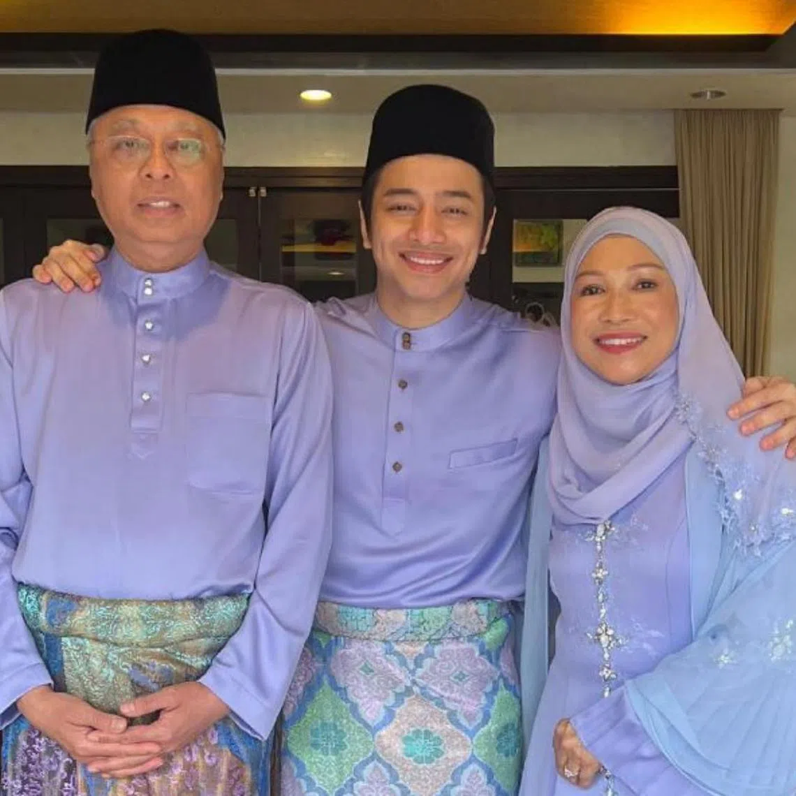 Malaysian actor and singer Dafi flanked by his parents Datuk Seri Ismail Sabri Yaakob and Datin Seri Muhaini Zainal Abidin.