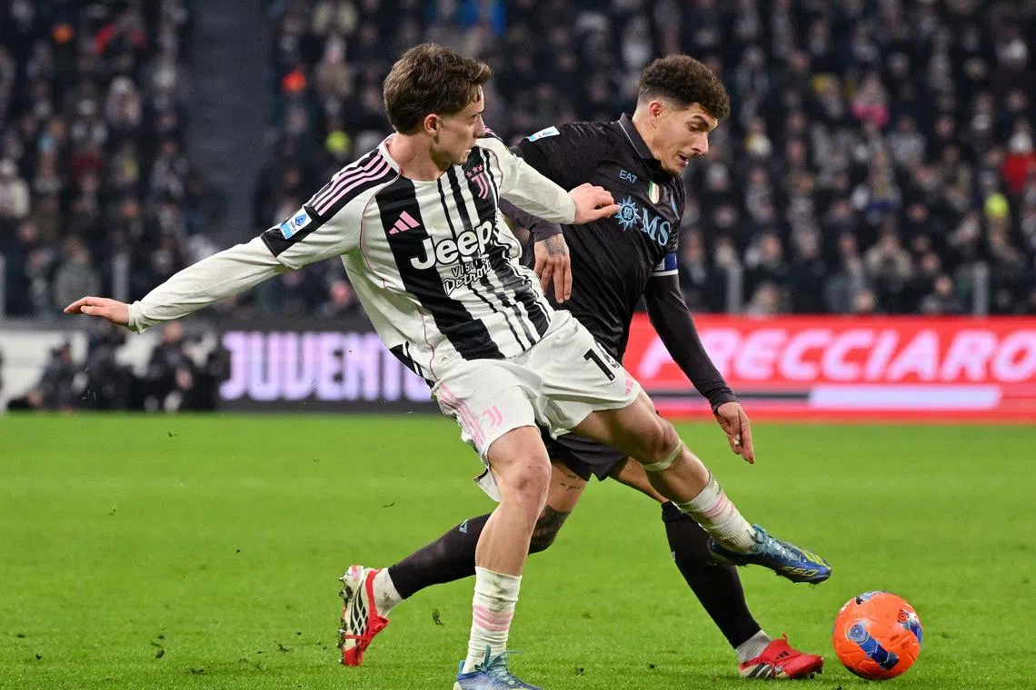 Soccer Football - Serie A - Juventus v Napoli - Allianz Stadium, Turin, Italy - January 25, 2026 Juventus' Kenan Yildiz in action with Napoli's Giovanni Di Lorenzo REUTERS/Alberto Lingria