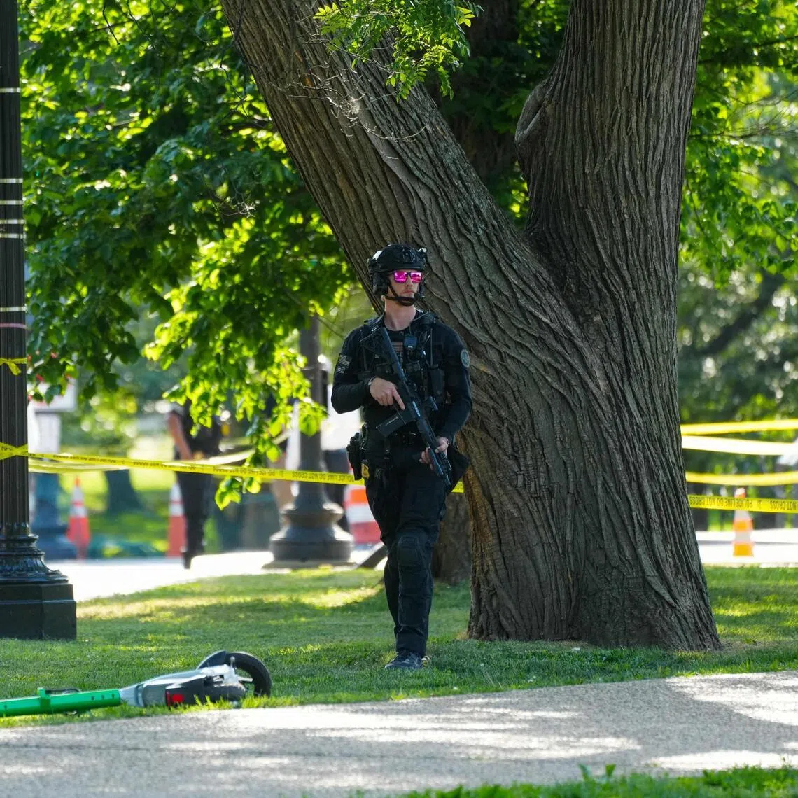 A US Secret Service officer protects the crime scene following an exchange of gunfire by the Secret Service and a gunman on the National Mall on May 4, 2026. 