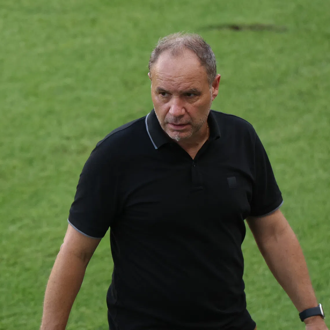 Jun 19, 2025; Houston, Texas, USA; Haiti head coach Sebastien Migne walks the sidelines during the second half against Trinidad and Tobago of a group stage match of the 2025 Gold Cup at Shell Energy Stadium. Mandatory Credit: Thomas Shea-Imagn Images