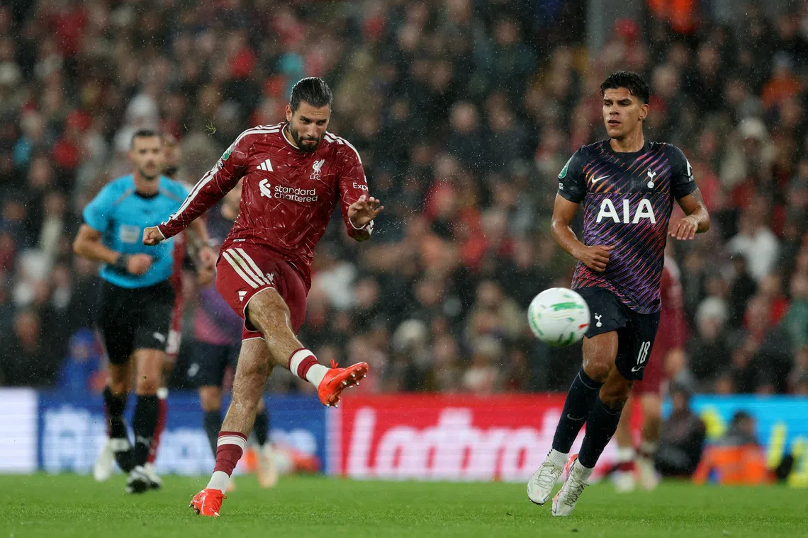 Liverpool’s Dominik Szoboszlai scores their third goal to give his side a 3-1 lead against Tottenham Hotspur in stoppage time.