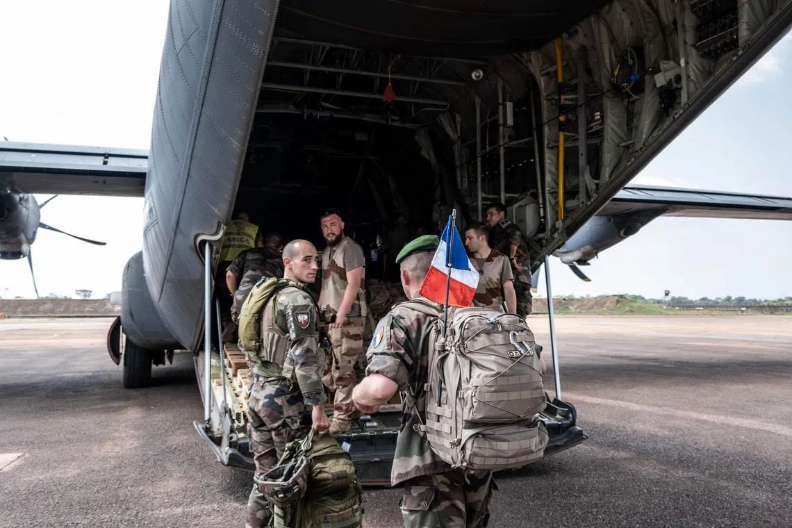 French soldiers prepare to leave Central Africa aboard a C130 cargo plane, on Dec 15, 2022, amid closer ties between the Republic and Russia.