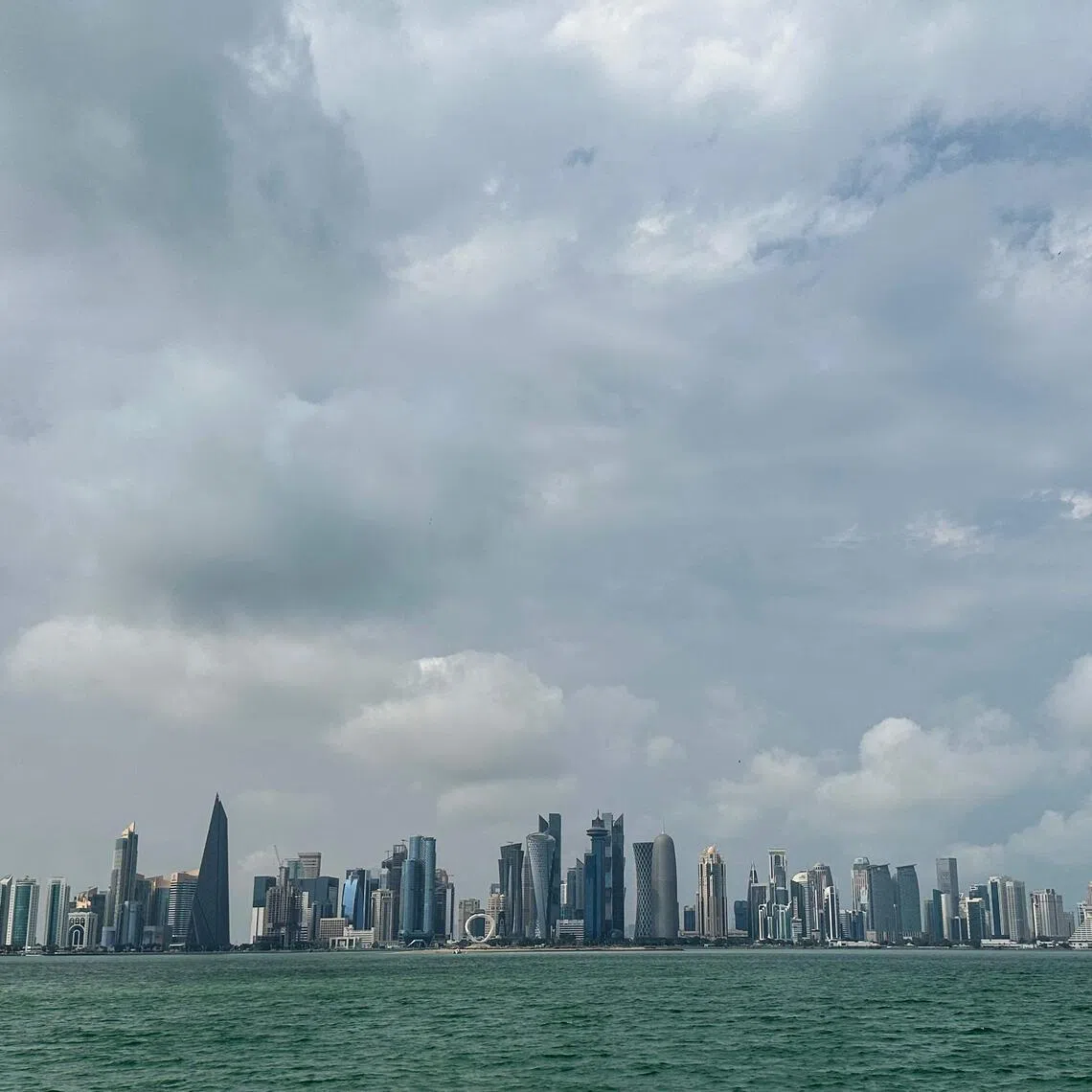 A photograph shows Doha's skyline on March 10, 2026. The oil-rich Gulf has borne the brunt of Iran's attacks in response to US-Israeli strikes that sparked the Middle East war, with Tehran targeting US assets but also civilian infrastructure, including energy facilities and airports. (Photo by AFP) / Attention editors: AFP covers the war in the Middle East through its extensive regional network, including bureaus in Tehran, Jerusalem, and several neighboring countries. Since the start of the conflict, journalists have been working under increasingly restrictive conditions. Authorities in several countries have limited reporters' movements, photo and live video coverage from sensitive locations. Some governments and armed groups have banned images of missile or drone strikes and other security-related sites. / 