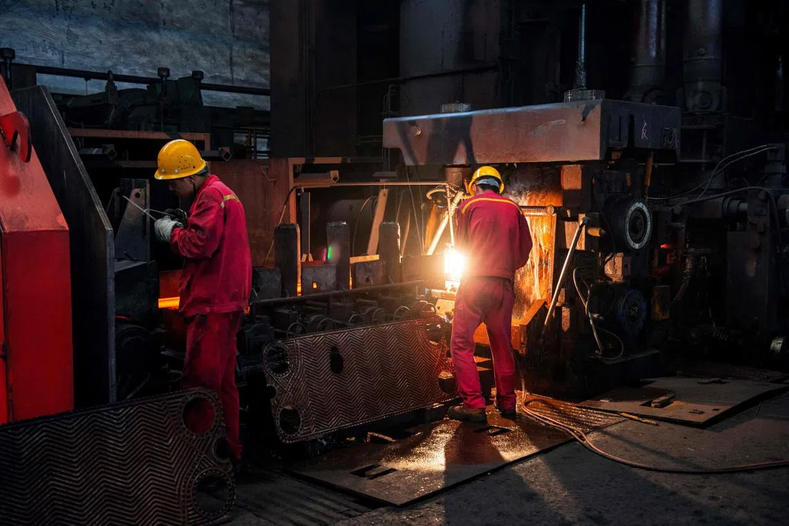 Workers in a steel factory in Huai’an, in China’s eastern Jiangsu province. While profits at China’s industrial firms extended a double-digit drop for the first eight months, the pace of declines eased slightly as a flurry of policy support steps has started to stabilise parts of the stuttering economy.