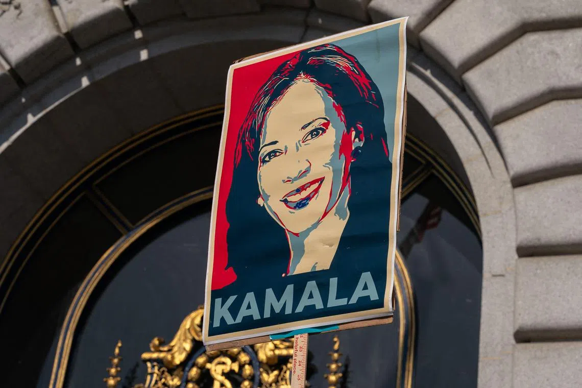 A supporter holds a sign as members of the San Francisco Democratic Party rally in support of Ms Kamala Harris on July 22 at City Hall in San Francisco, California. 