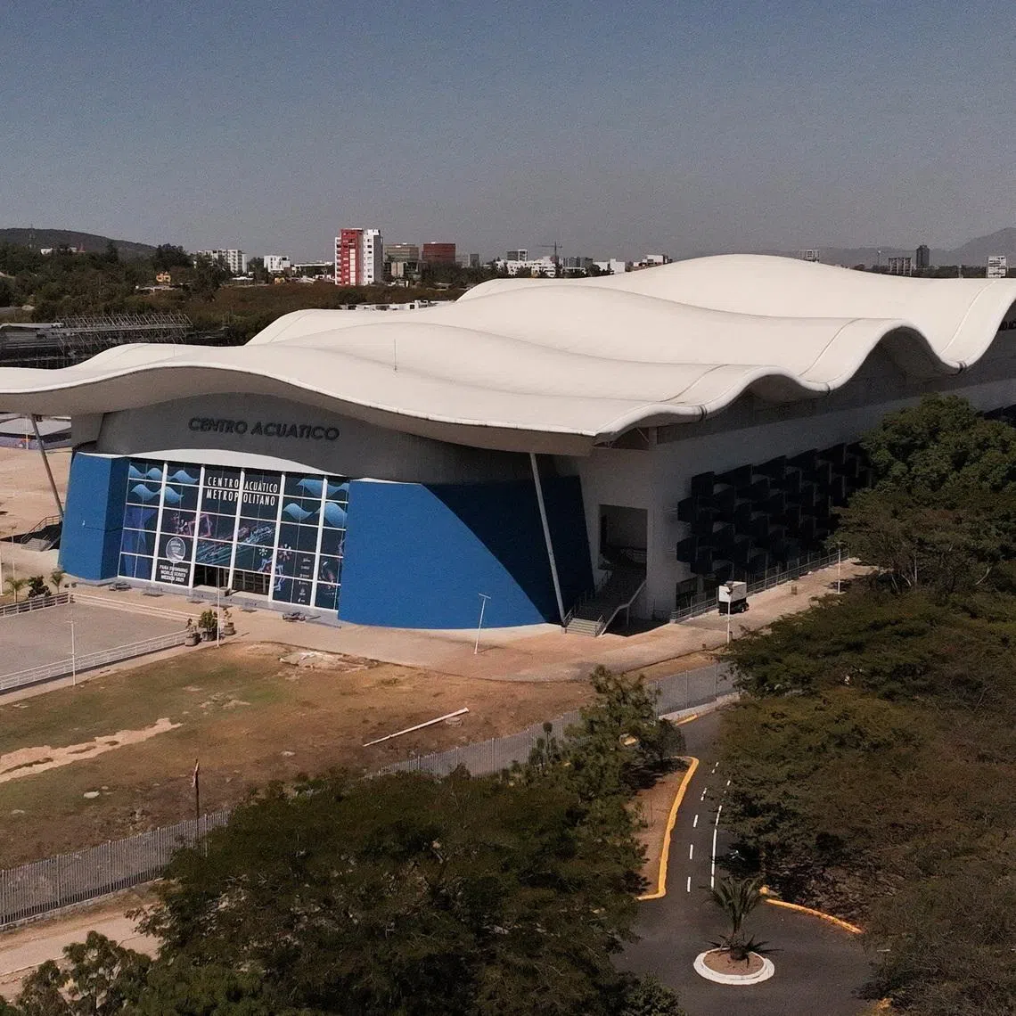 A drone view shows the Centro Acuatico Code Metropolitano after World Aquatics, the governing body for aquatic sports worldwide, canceled the early‑March Diving World Cup stop in Mexico due to violence following a military operation that killed drug lord Nemesio Oseguera Cervantes, known as “El Mencho,” in Zapopan, Mexico, February 26, 2026. REUTERS/Alberto Fajardo