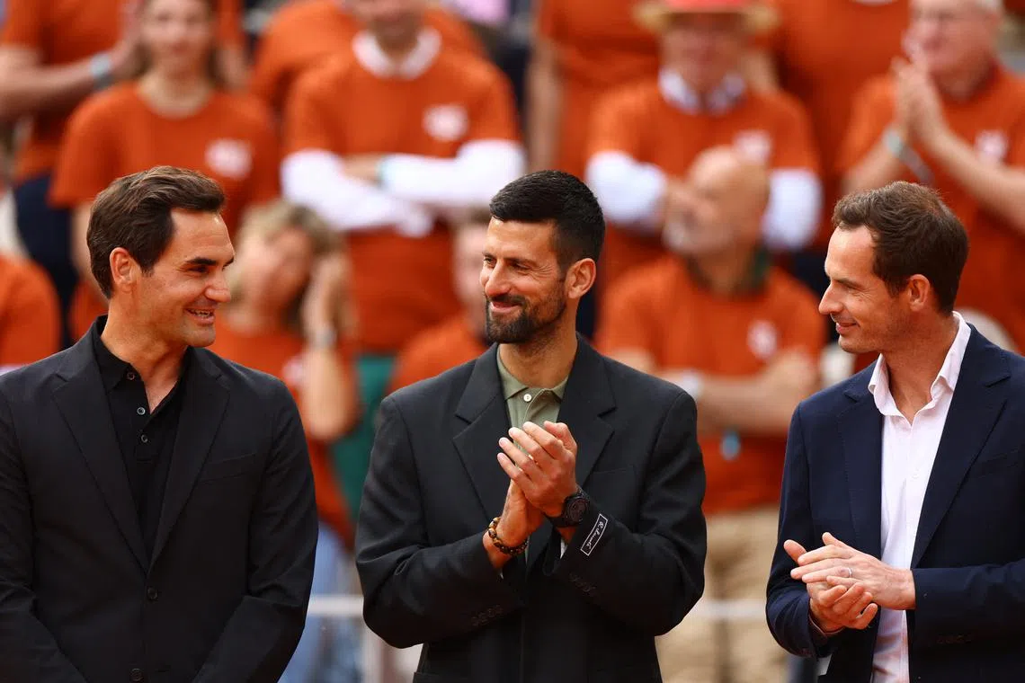 Tennis - French Open - Roland Garros, Paris, France - May 25, 2025 Switzerland's Roger Federer, Serbia's Novak Djokovic and Britain's Andy Murray during a tribute to former player and record French Open winner Rafael Nadal REUTERS/Lisi Niesner