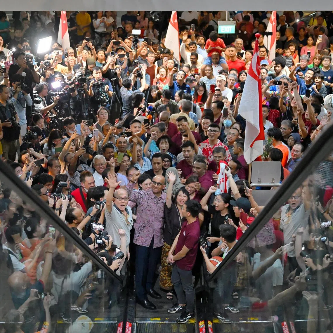 Landslide victory: Mr Tharman Shanmugaratnam surrounded by cheering supporters at Taman Jurong Market and Food Centre after the presidential election results were announced on Sept 1, 2023.