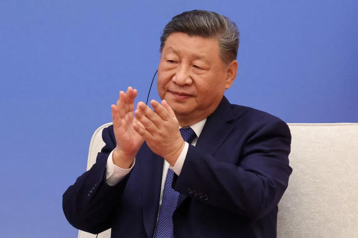 FILE PHOTO: Chinese President Xi Jinping applauds during the 7th formal meeting of the Franco-Chinese Business Council in Beijing, China, on December 4, 2025.  LUDOVIC MARIN/Pool via REUTERS/File Photo