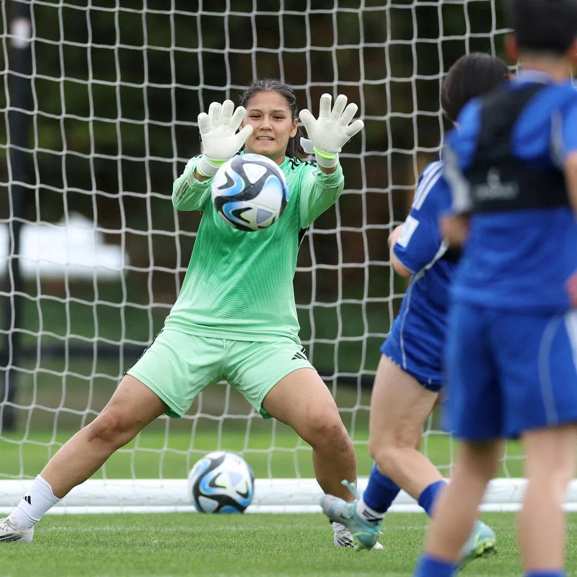 Elaha Safdari of the Afghan Women's Refugee team makes a save during a selection camp at St. George's Park in Britain, on Aug 26, 2025.