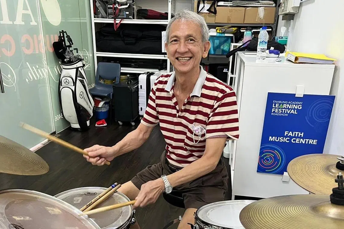 Mr Remus Tan, a 72-year-old senior living with dementia, learnt how to play drums at Faith Music Centre as part of AWWA's Care Beyond Walls project.