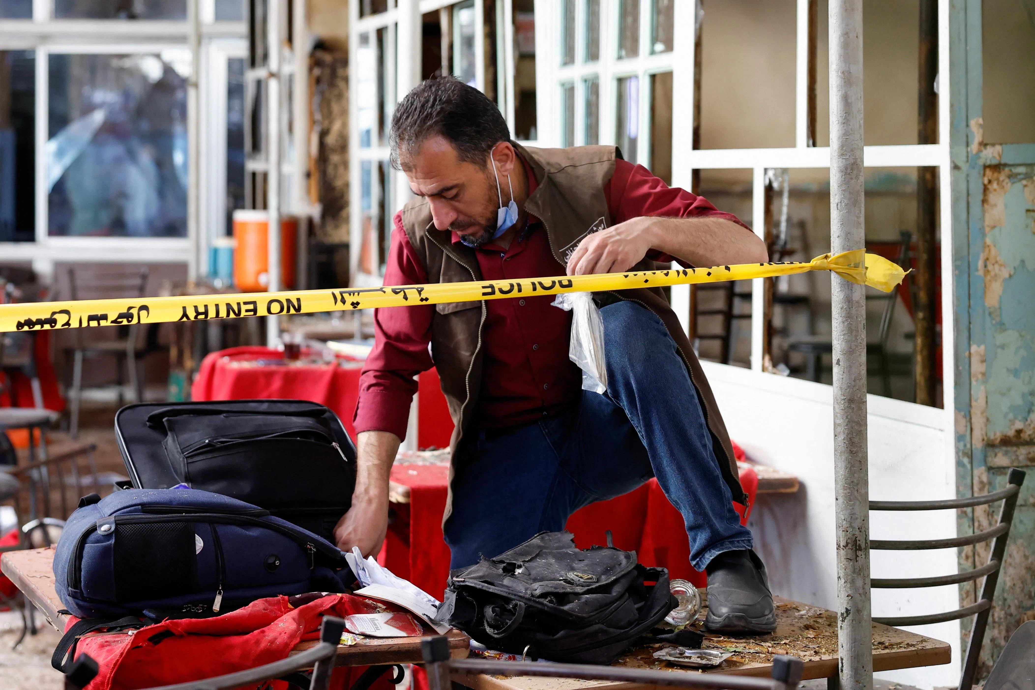 An emergency service member works at the site of what Syrian state media reported was a blast at a cafe in central Damascus, Syria, July 2, 2026. REUTERS/Yamaam Al Shaar