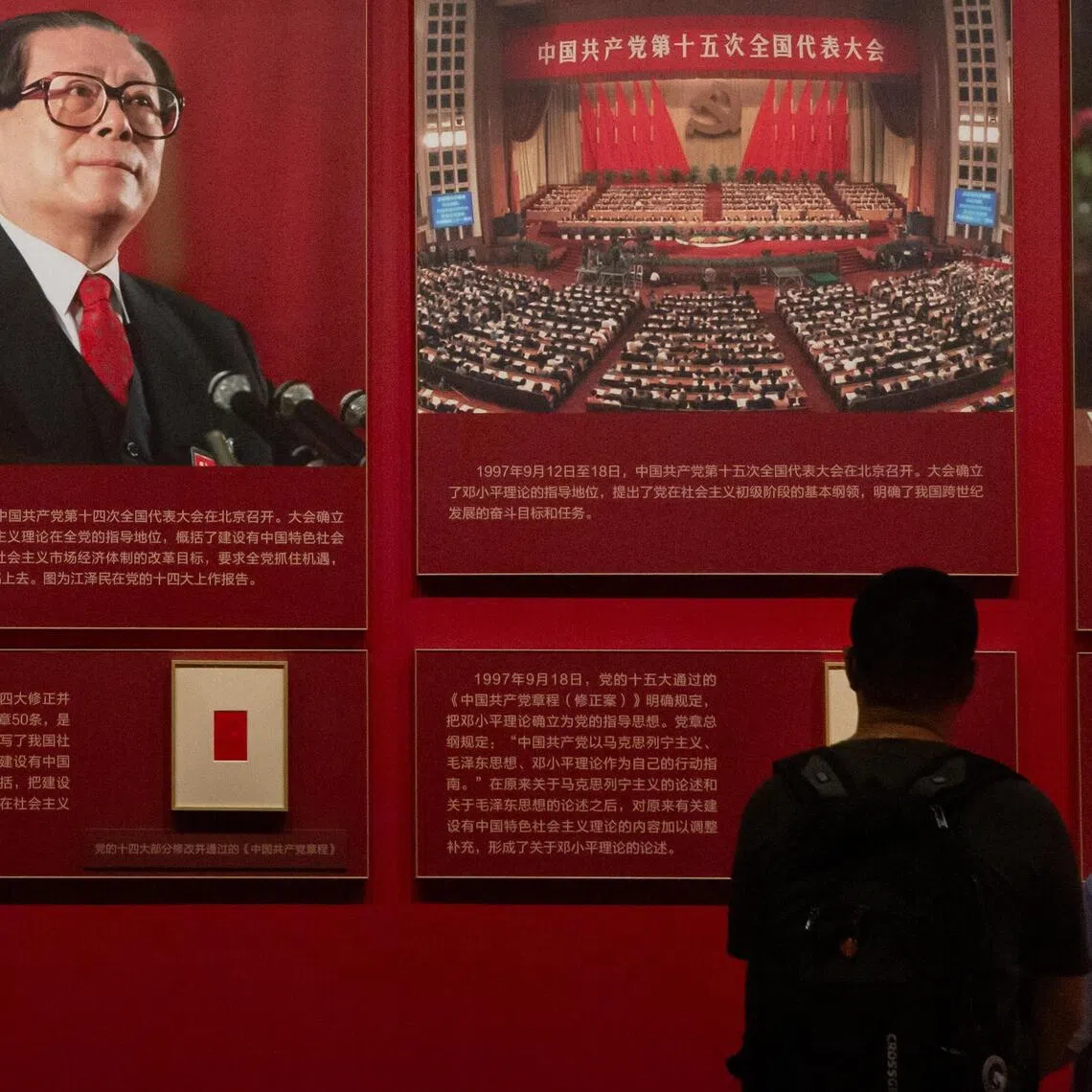 People viewing an exhibition on former Chinese President Jiang Zemin at the Museum of the Communist Party in Beijing on Aug 15.