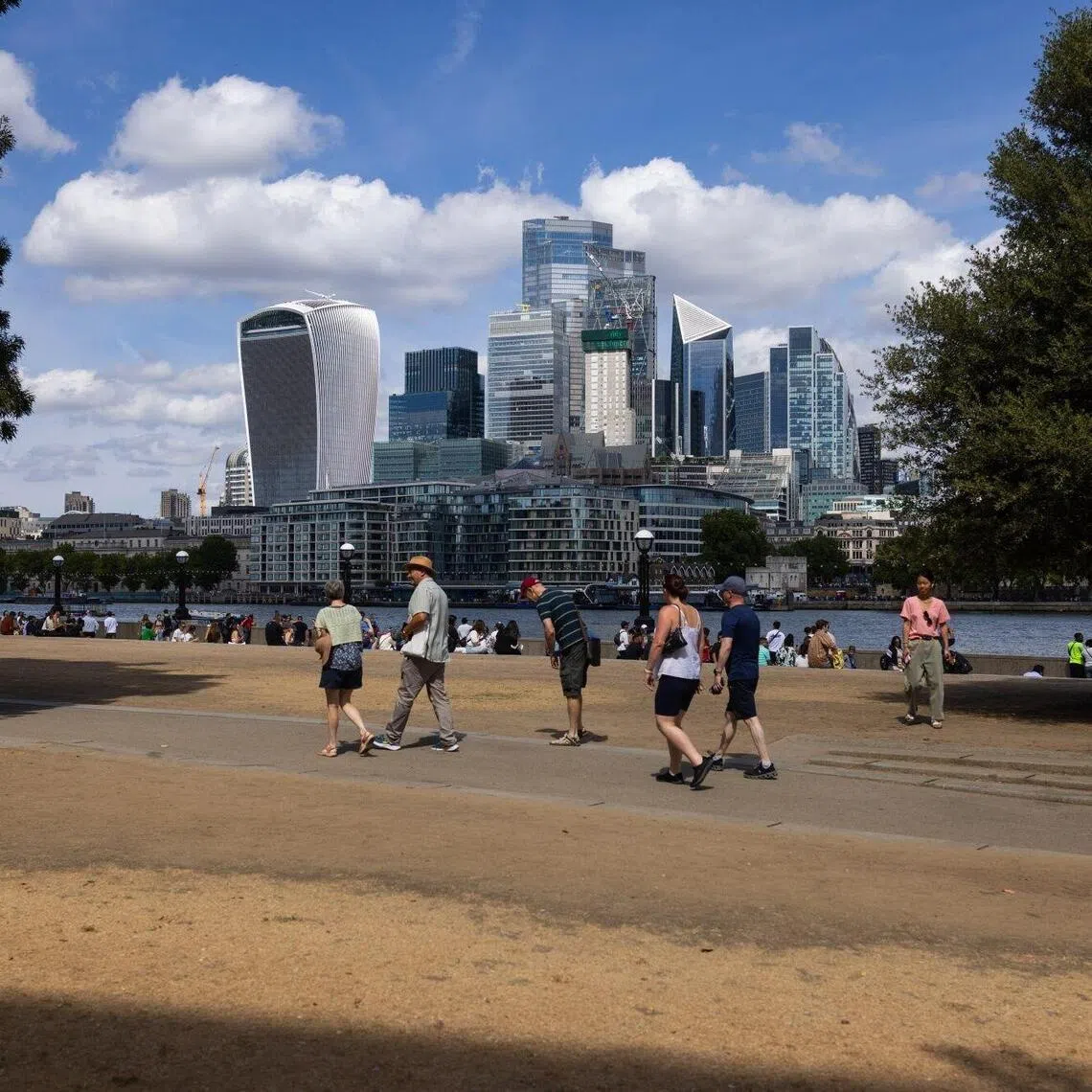 Dried out grass by the River Thames in London on Aug 10. Parks and fields that are usually green at this point in the year are parched and yellow amid a drought in England.