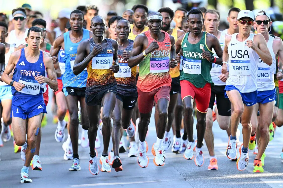 Kenya's two-time defending champion Eliud Kipchoge (centre) and other athletes compete in the Paris Olympics men's marathon on Aug 10, 2024.