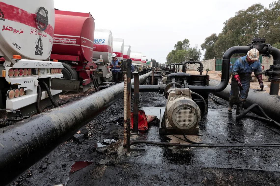 FILE PHOTO: Oil trucks arriving from Iraq at the Baniyas oil terminal, in Baniyas, Syria, May 14, 2026.  REUTERS/Mahmoud Hassano/File Photo