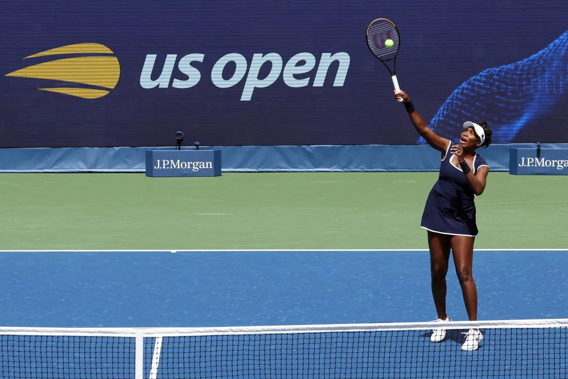 FILE PHOTO: Tennis - U.S. Open - Flushing Meadows, New York, United States - August 19, 2025  Venus Williams of the U.S. during the warm up with Reilly Opelka of the U.S. ahead of their round of 16 mixed doubles match against Russia's Andrey Rublev and Czech Republic's Karolina Muchova REUTERS/Kylie Cooper/File photo