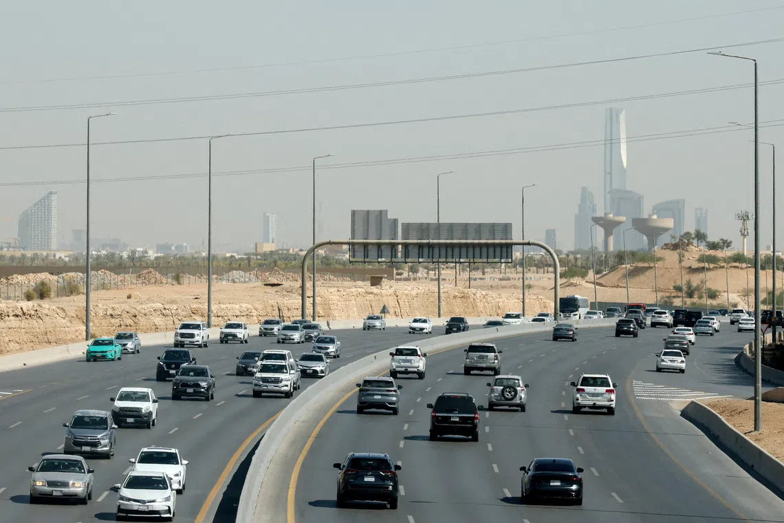 FILE PHOTO: Traffic moves on a road, with the city's skyline visible in the background, in Riyadh, Saudi Arabia, February 9, 2026. REUTERS/Isabel Infantes/File Photo