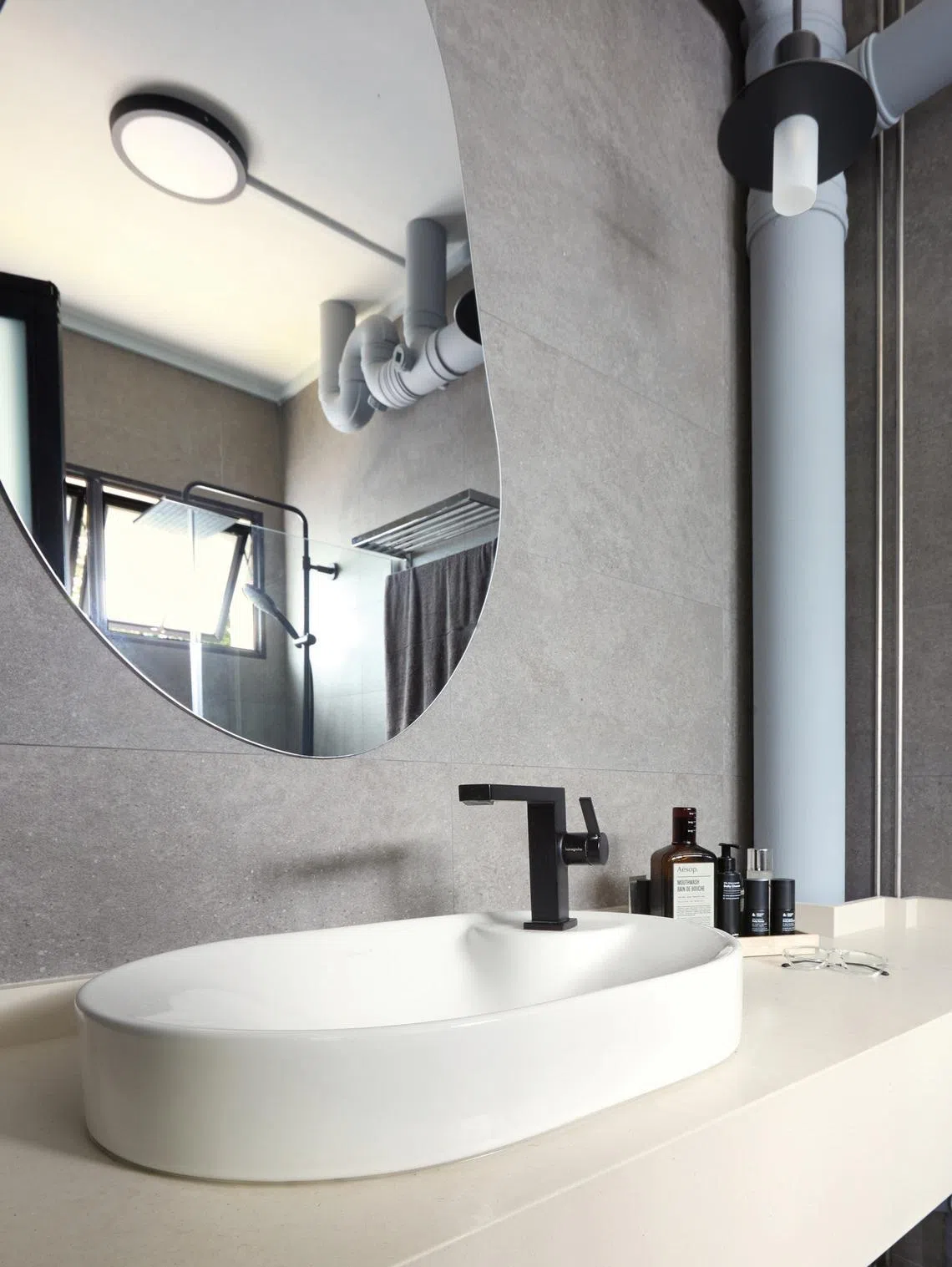 The en-suite bathroom’s palette matches the master bedroom’s.