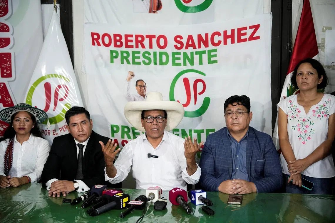 Roberto Sanchez, presidential candidate of the Together for Peru party, speaks with members of the media as he waits for the election results after Peru's general election was extended to a second day in some precincts of the capital, in Lima, Peru, April 14, 2026. REUTERS/Angela Ponce