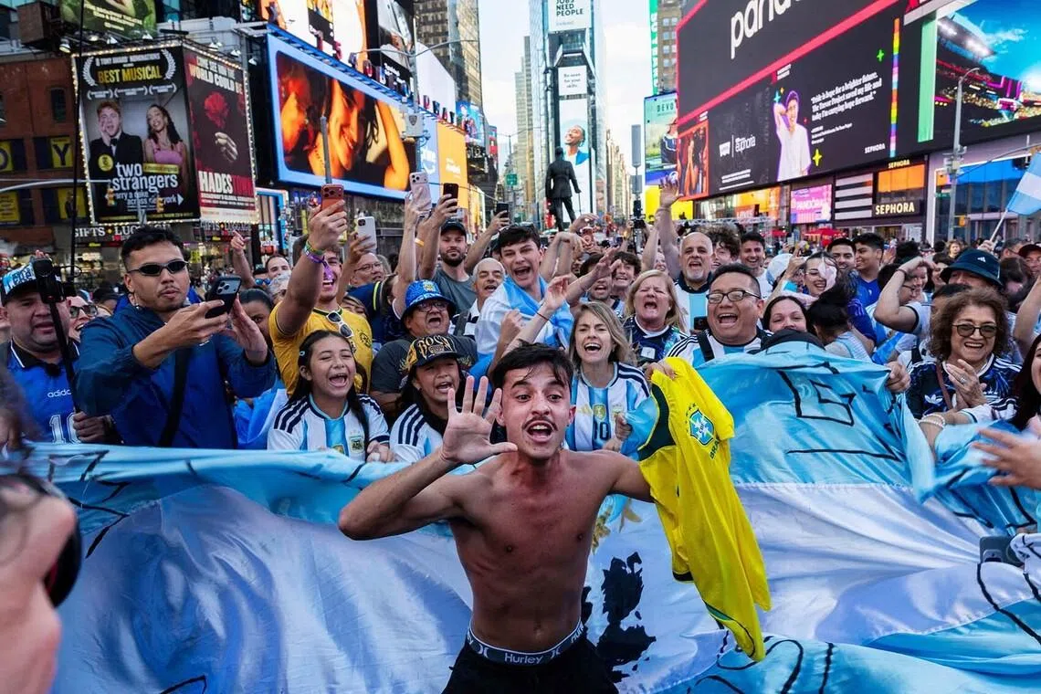 A man holding a Brazil shirt as Argentina soccer fans gather in Times Square, New York, June 15. 