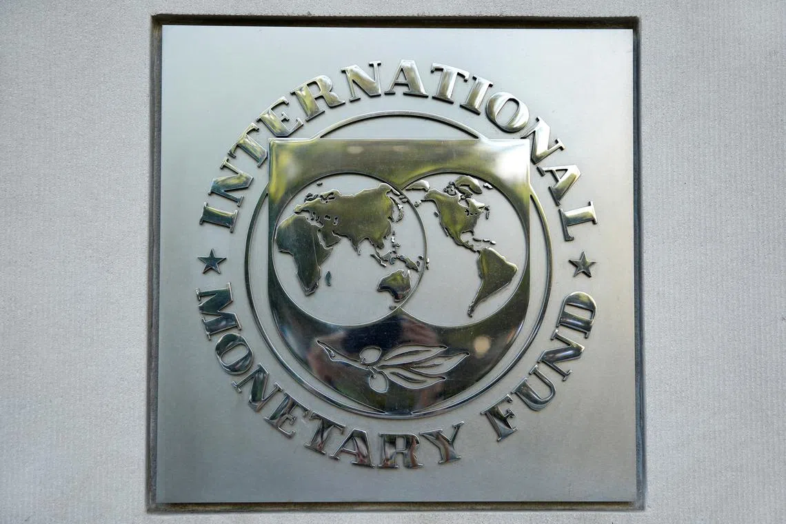 FILE PHOTO: International Monetary Fund (IMF) logo is seen at the IMF headquarters building during the IMF/World Bank annual meetings in Washington, U.S., October 14, 2017. REUTERS/Yuri Gripas/File Photo