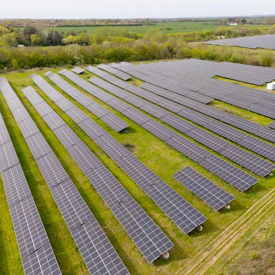 The British government said placing solar panels and wind turbines could power about five million homes.