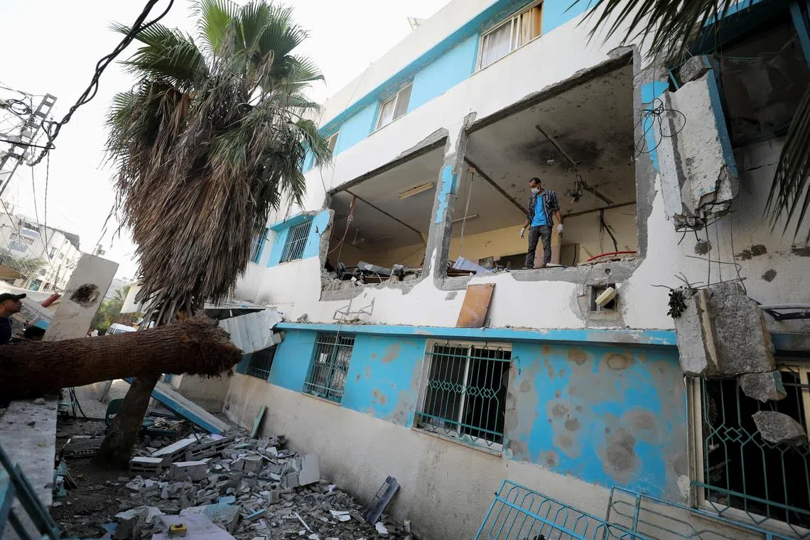 A Palestinian inspects the damages at Al-Daraj clinic which was hit in an Israeli strike, amid the Israel-Hamas conflict, in Gaza City June 24, 2024. REUTERS/Dawoud Abu Alkas