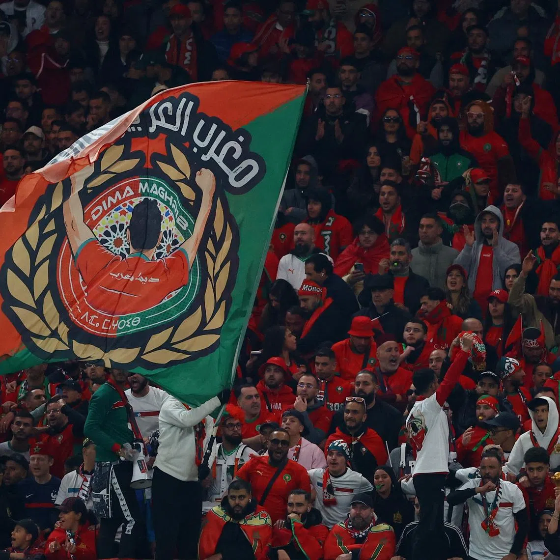 FILE PHOTO: Soccer Football - CAF Africa Cup of Nations - Morocco 2025 - Final - Senegal v Morocco - Prince Moulay Abdellah Stadium, Rabat, Morocco - January 18, 2026 A Morocco fan waves a flag in the stands during the match REUTERS/Siphiwe Sibeko/ File Photo
