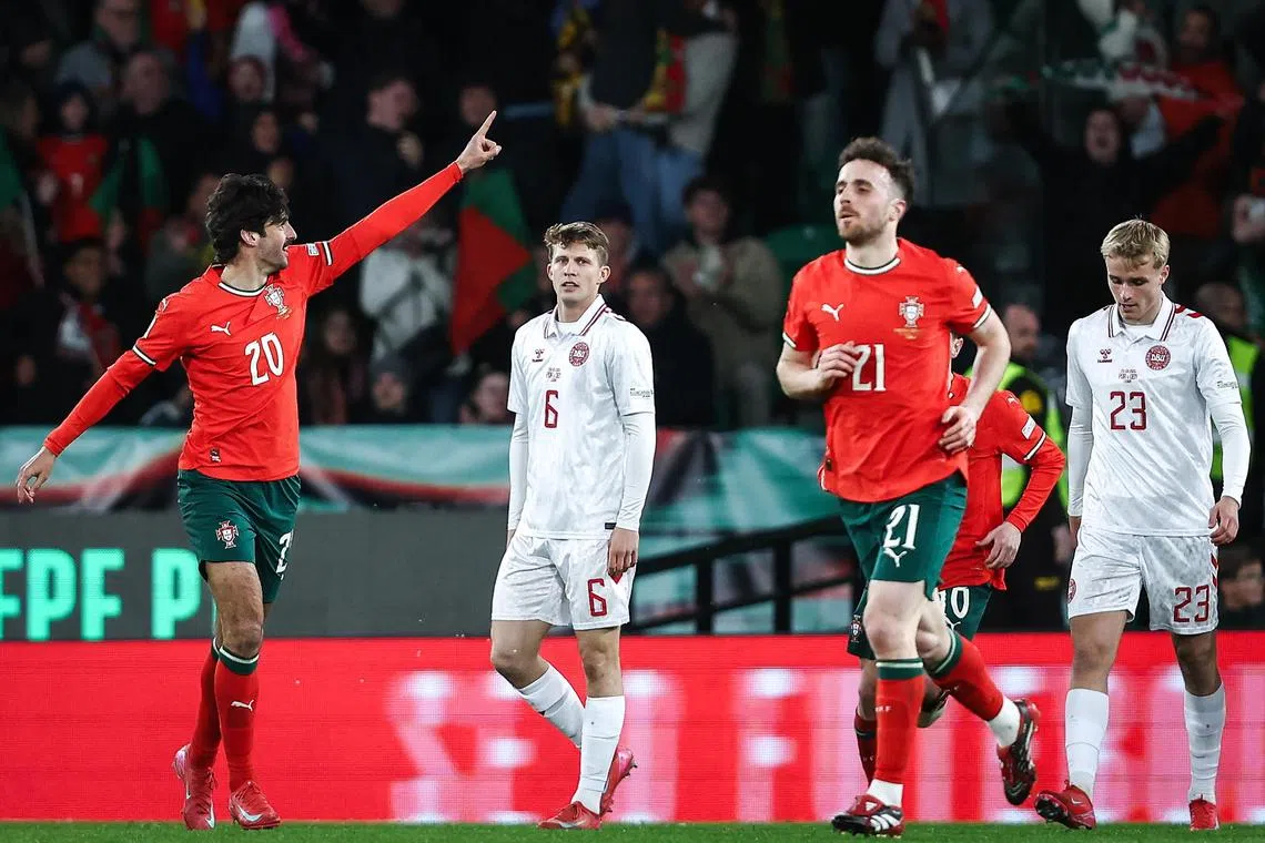 Portugal's Francisco Trincao (left) celebrates one of his two goals in the Uefa Nations League quarter-final second leg against Denmark at Alvalade Stadium in Lisbon on  March 23, 2025.
