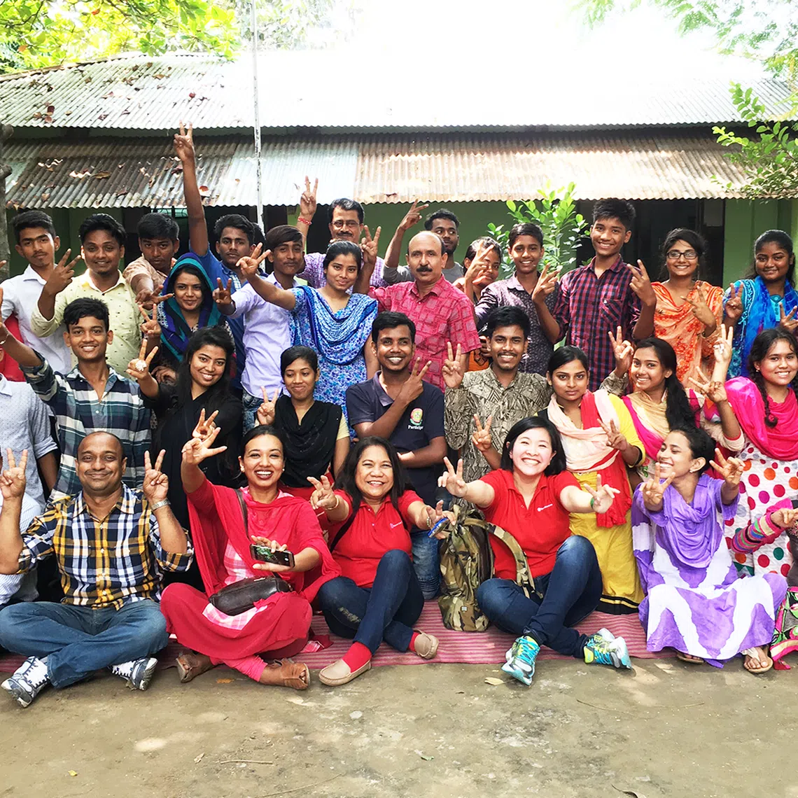 In 2017, Ms Kelly Kwong (front row, third from right) volunteered in India, Bangladesh and the Philippines, where she supported youth development programmes as part of a six-month sabbatical fully backed by her employer.