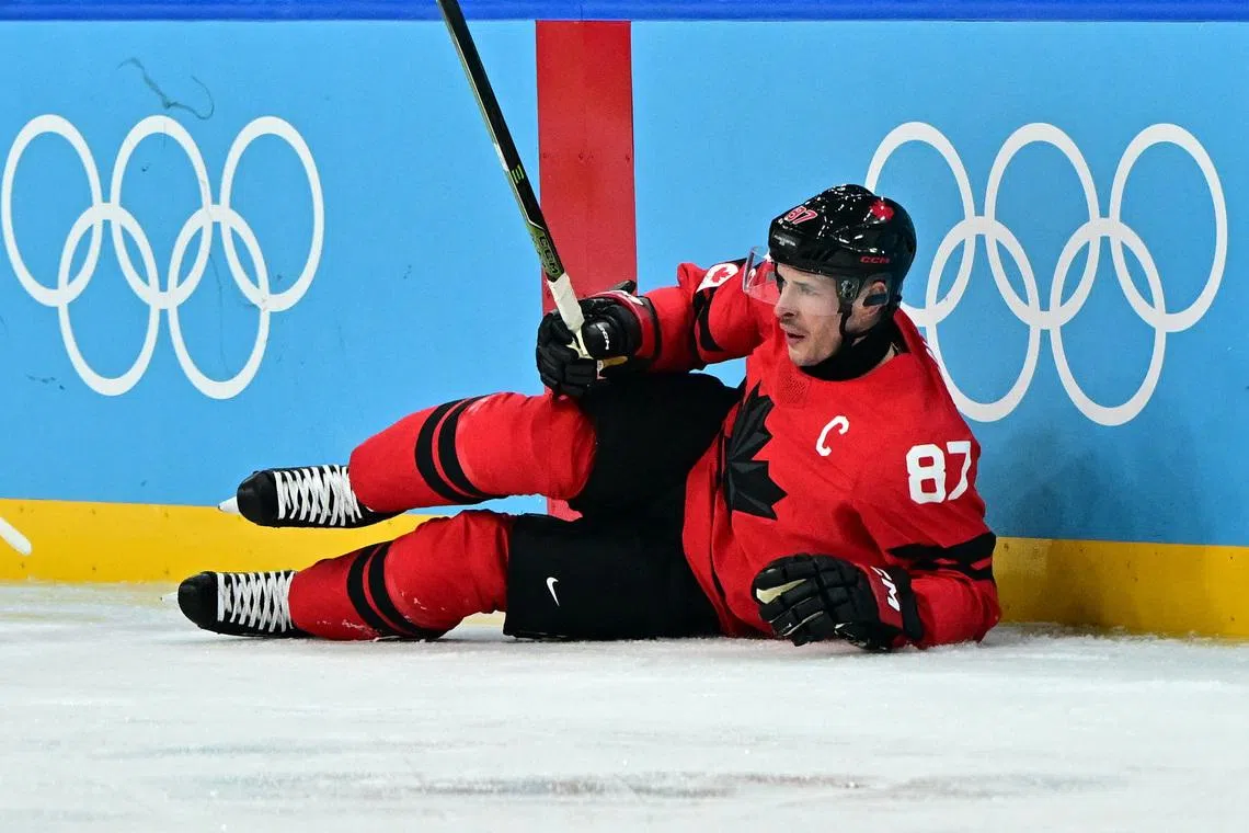 Milano Cortina 2026 Olympics - Ice Hockey - Men's Play-offs Quarterfinals - Canada vs Czech Republic - Milano Santagiulia Ice Hockey Arena, Milan, Italy - February 18, 2026. Sidney Crosby of Canada reacts after sustaining an injury REUTERS/Marton Monus