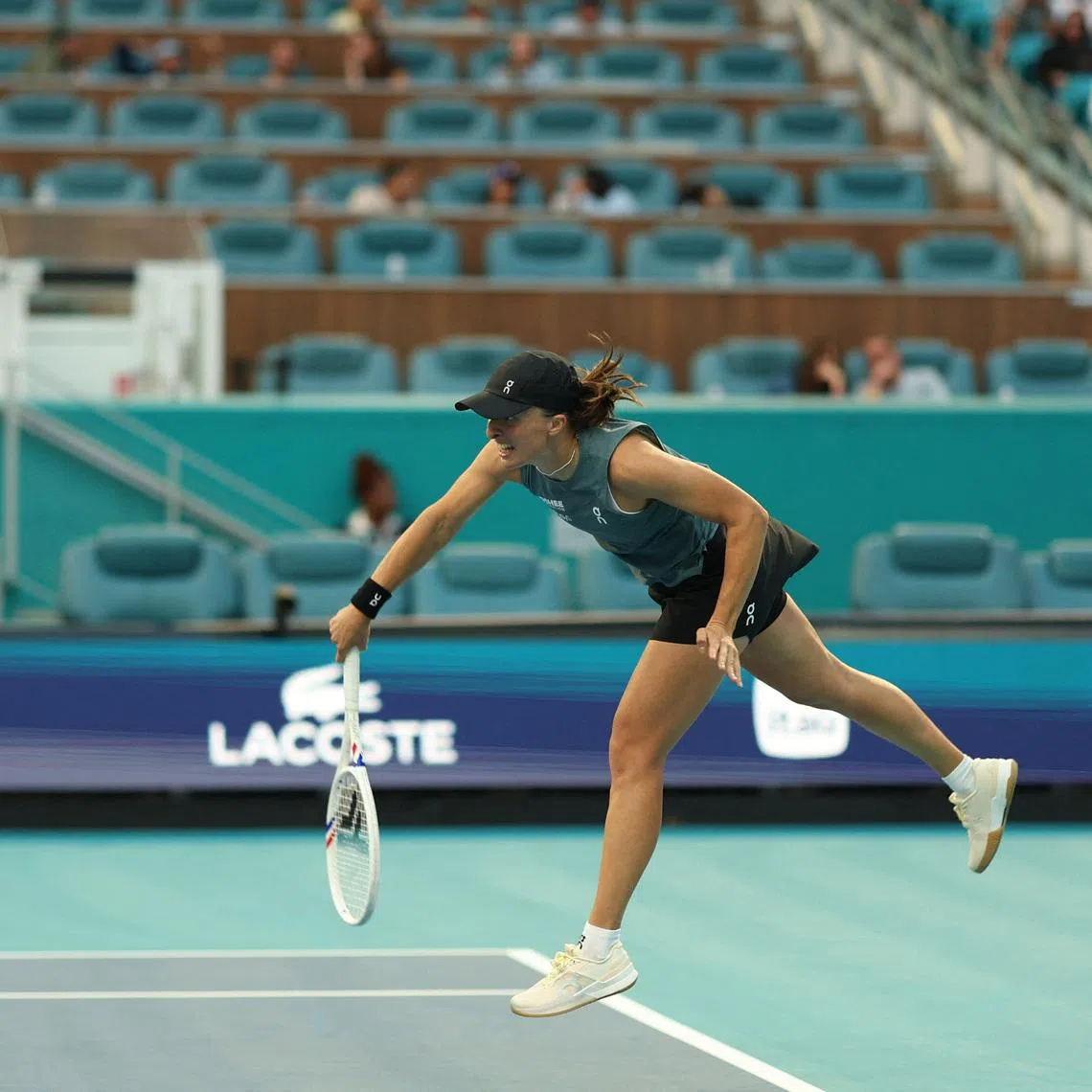 Mar 19, 2026; Miami Gardens, FL, USA; Iga Swiatek (POL) serves against Magda Linette (POL) (not pictured) on day three of the 2026 Miami Open at Hard Rock Stadium. Mandatory Credit: Geoff Burke-Imagn Images