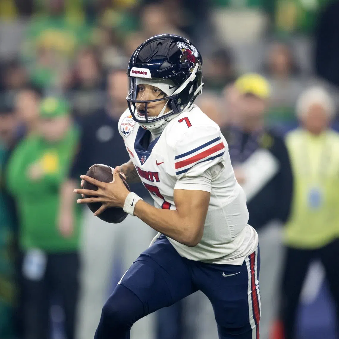 Jan 1, 2024; Glendale, AZ, USA; Liberty Flames quarterback Kaidon Salter (7) against the Oregon Ducks in the 2024 Fiesta Bowl at State Farm Stadium. Mark J. Rebilas-USA TODAY Sports/File Photo