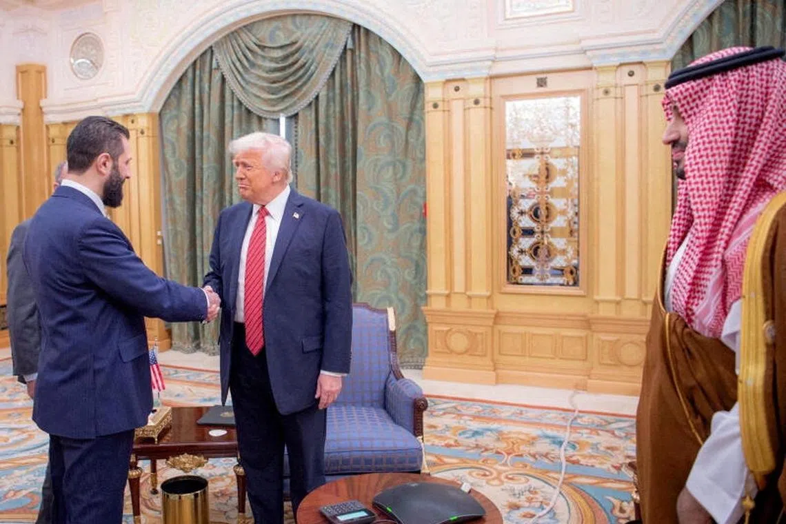 FILE PHOTO: U.S. President Donald Trump meets with Syrian President Ahmed al-Sharaa in Riyadh, Saudi Arabia, in this handout released on May 14, 2025. Saudi Press Agency/Handout via REUTERS THIS IMAGE HAS BEEN SUPPLIED BY A THIRD PARTY/File Photo