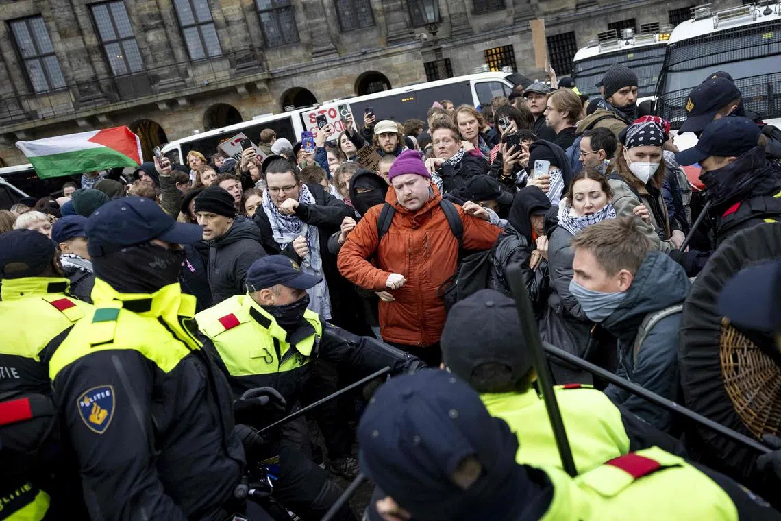 Amsterdam police said some Maccabi supporters had burned a Palestinian flag on the Dam central square, and vandalised a taxi.