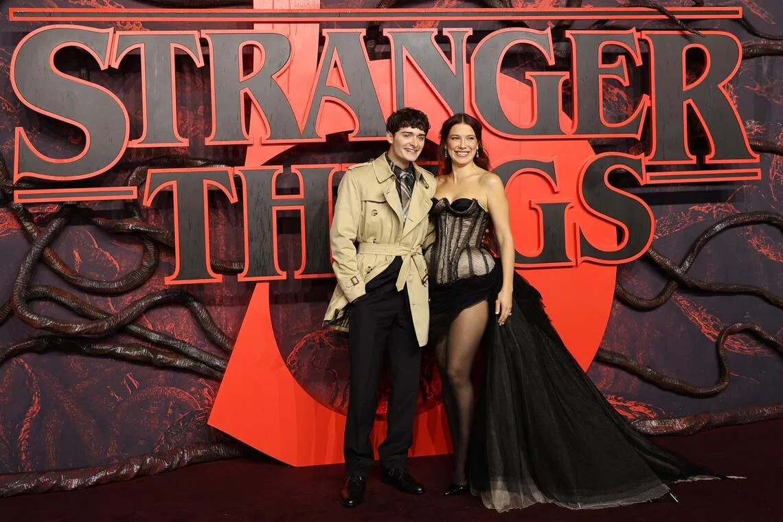 Actors Noah Schnapp (left) and Millie Bobby Brown at Stranger Things 5's premiere in London on Nov 13, 2025.