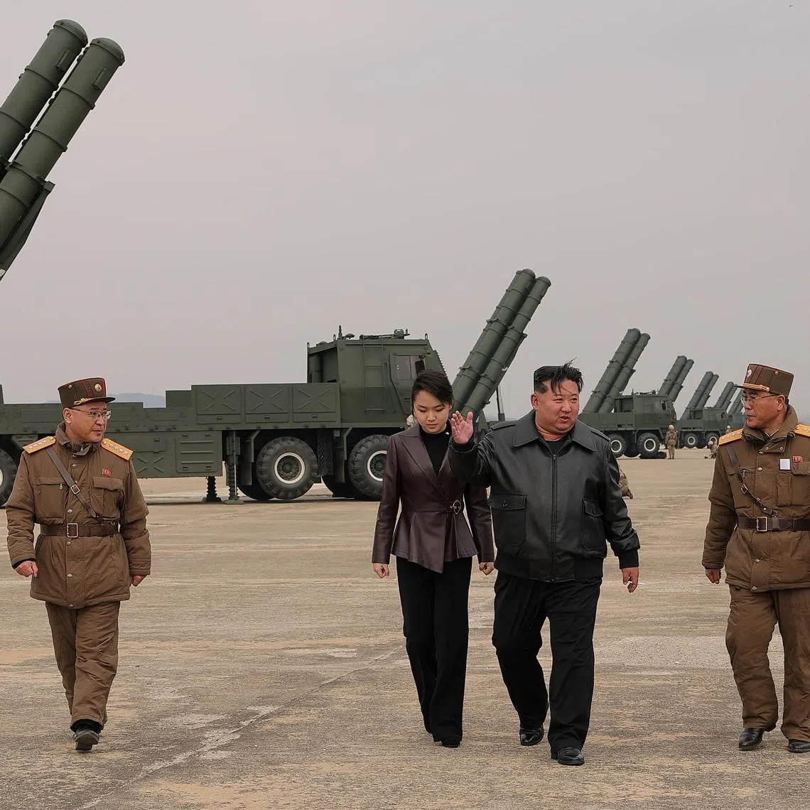 North Korean leader Kim Jong Un, accompanied by his daughter Kim Ju Ae, overseeing the test launch on March 14.
