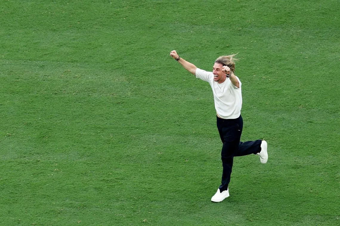 Ecuador coach Sebastian Beccacece celebrating after their 2-1 victory against Germany on June 25.
